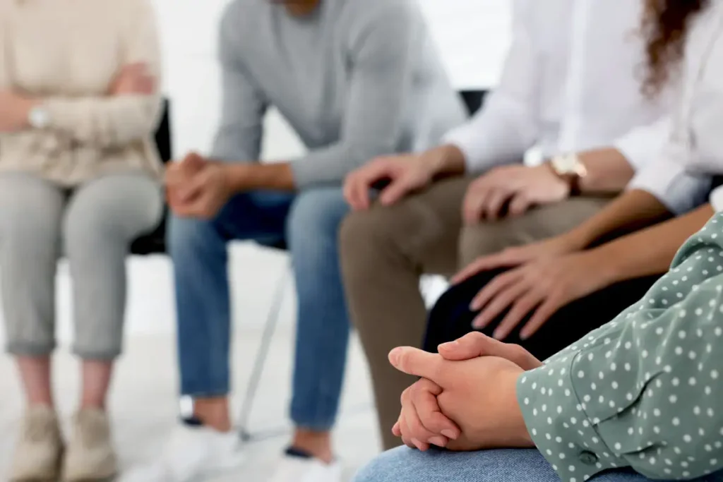 people during a group therapy in a sober living house in southern california